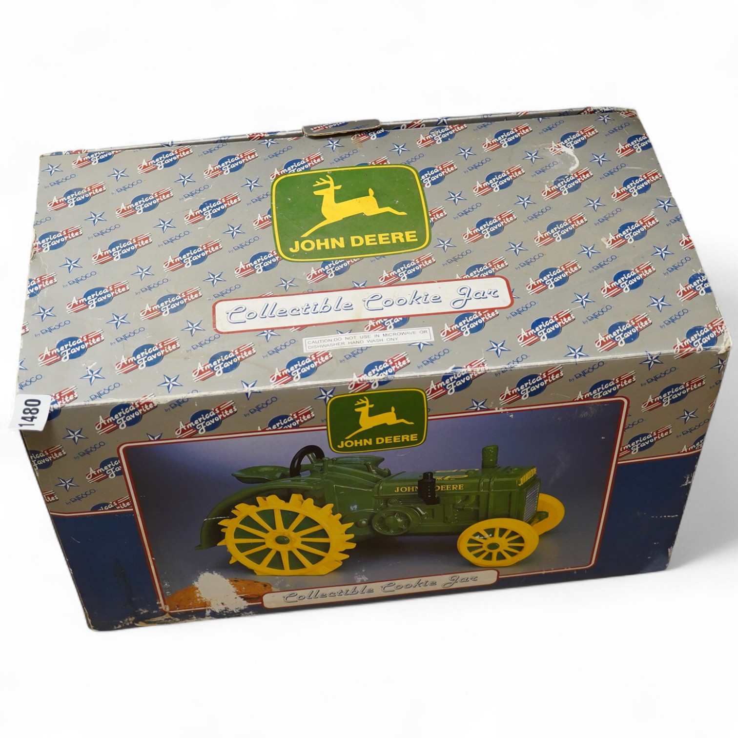 A boxed Enesco collectible cookie jar (biscuit barrel) in the form of a John Deere tractor